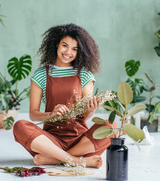 Young,Woman,Cultivating,Home,Plants.small,Business.sensual,Mixed,Race,Female,Florist